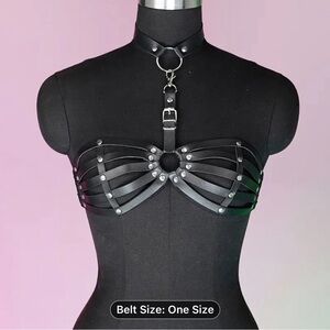 Black faux leather harness top with silver hardware